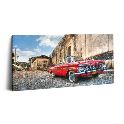 Imprimare tablou canvas 120x60 Mașină roșie veche în cartierul columbian