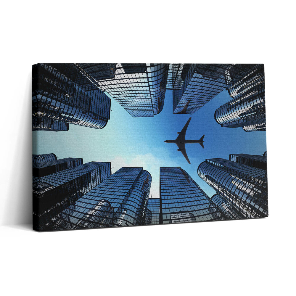 Tablou canvas 30x20 Avion deasupra clădirilor