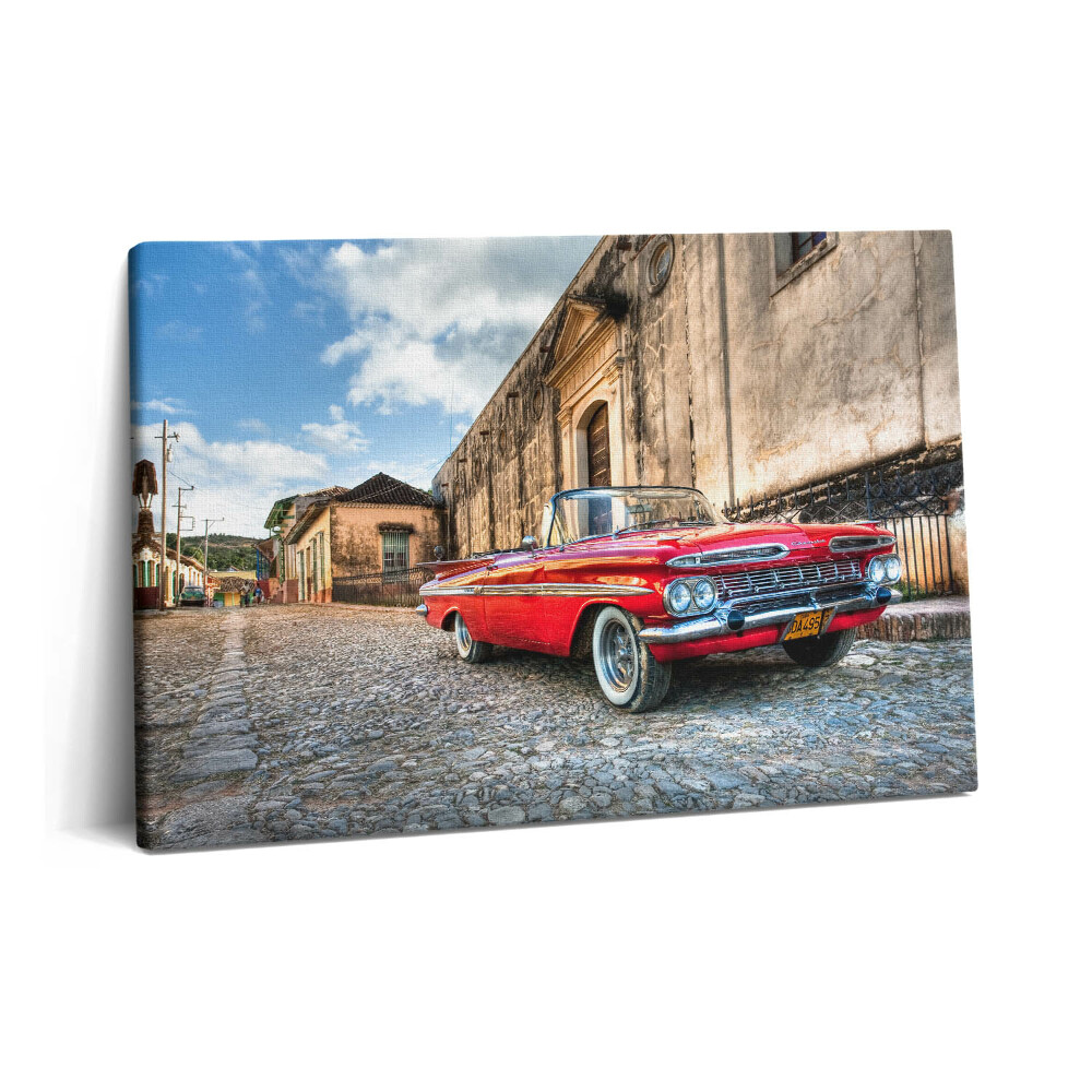 Tablou pe pânză 60x40 Mașină roșie veche în cartierul columbian