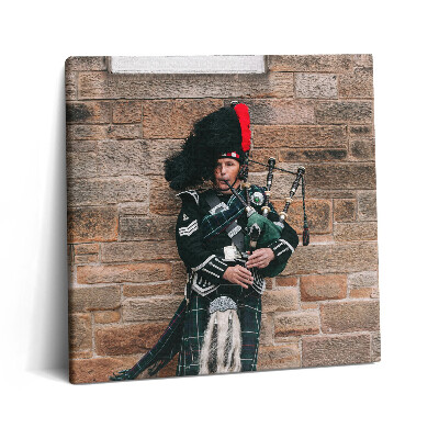 Tablou pe pânză canvas 60x60 Un muzician care cântă la cimpoi
