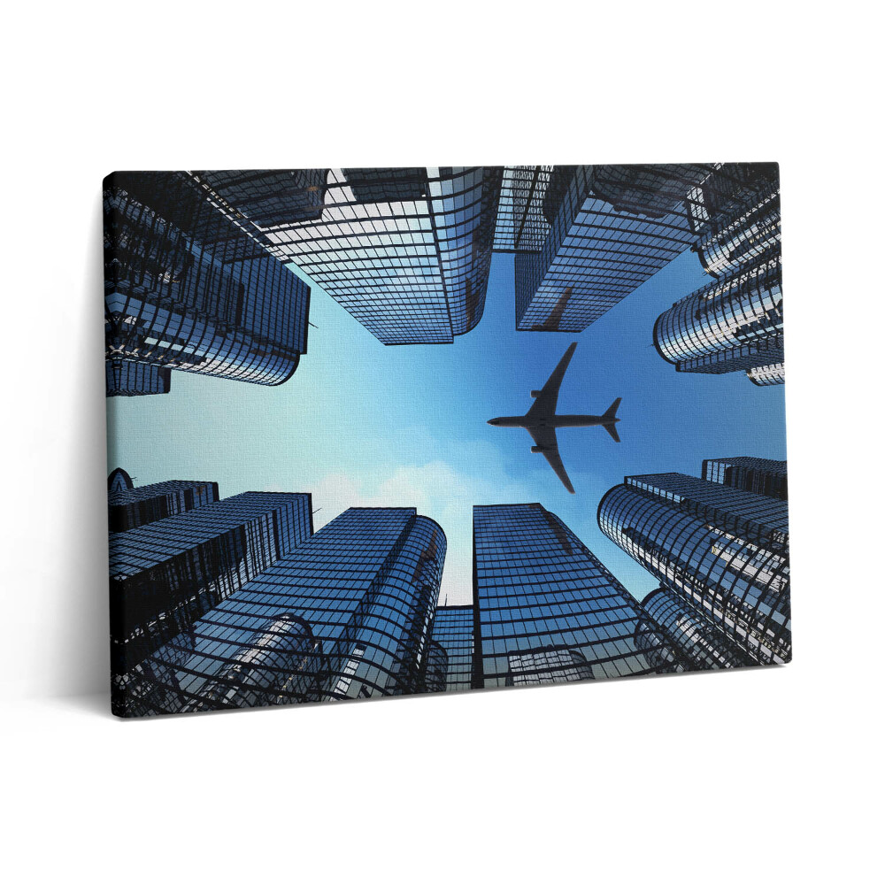 Pictură pe pânză 80x60 Avion deasupra clădirilor