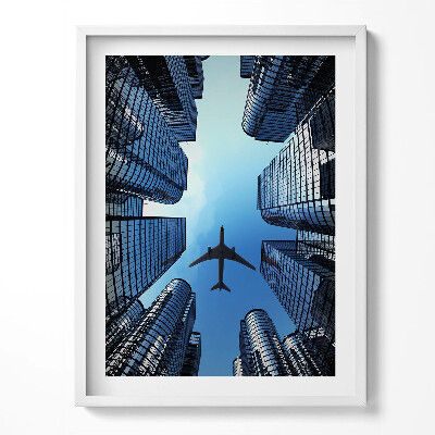 Tablou living cu rama Avion deasupra clădirilor