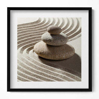 Tablou rama unic O grămadă de pietre pe nisip zen