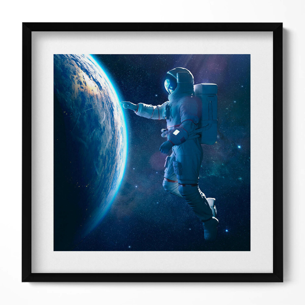 Tablou living cu rama unic Astronautul și Planeta Pământ