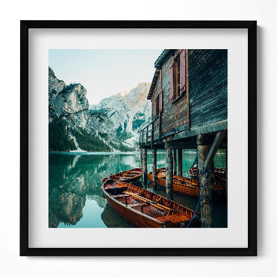 Tablou living cu rama unic Cabană de munte pe lac și o barcă