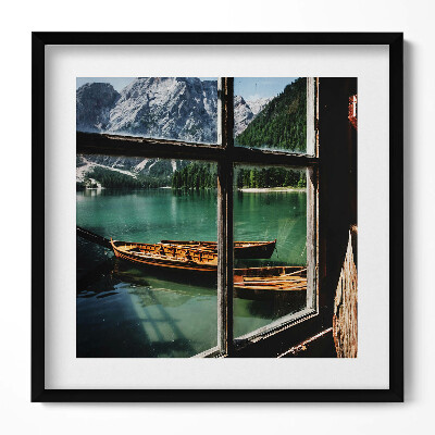 Tablou rama unic O vedere de la fereastră spre un lac cu o barcă