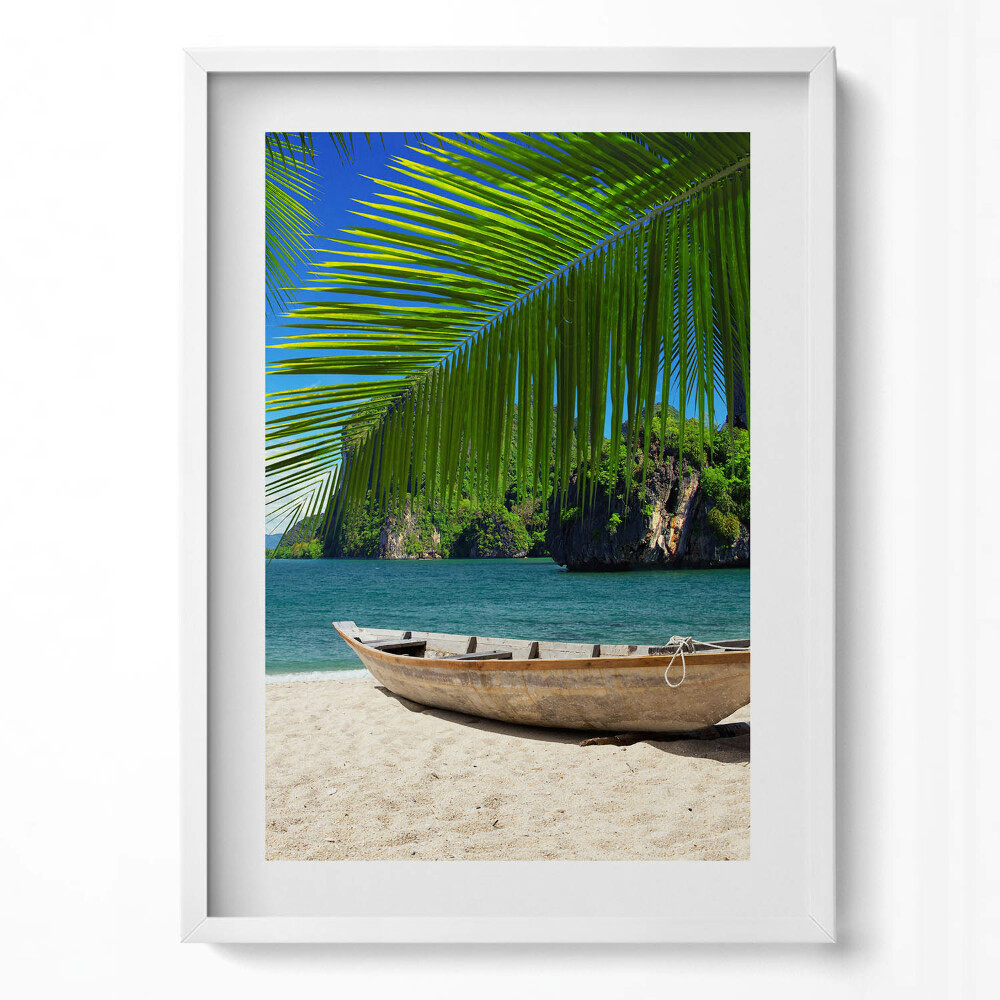Tablou living cu rama modern O barcă pe plajă sub un palmier