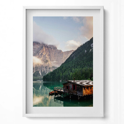 Tablou living cu rama modern O casă pe un lac în munți