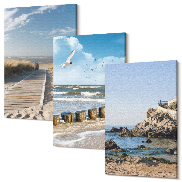 Tablou 3 piese Plajă cu potecă de lemn, mare și stânci de pe litoral