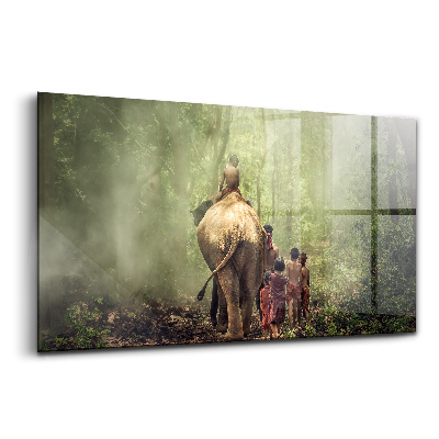 Tablou pe sticlă Copii conducând un elefant
