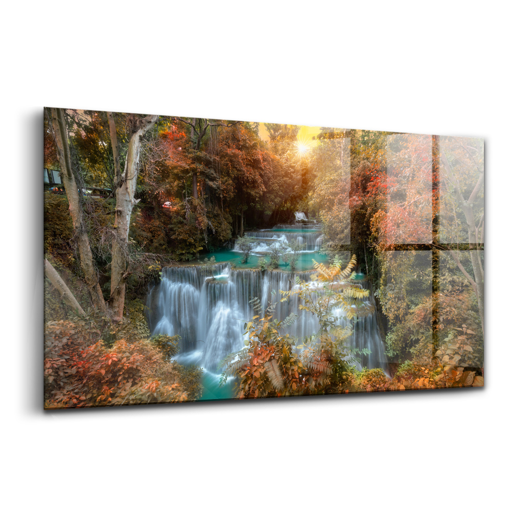 Tablou pe sticlă Apus de soare peste cascadă