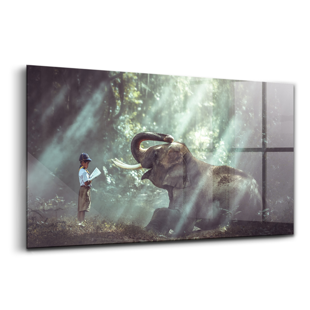 Tablou pe sticlă Un băiat citește o carte