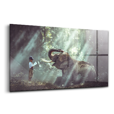 Tablou pe sticlă Un băiat citește o carte