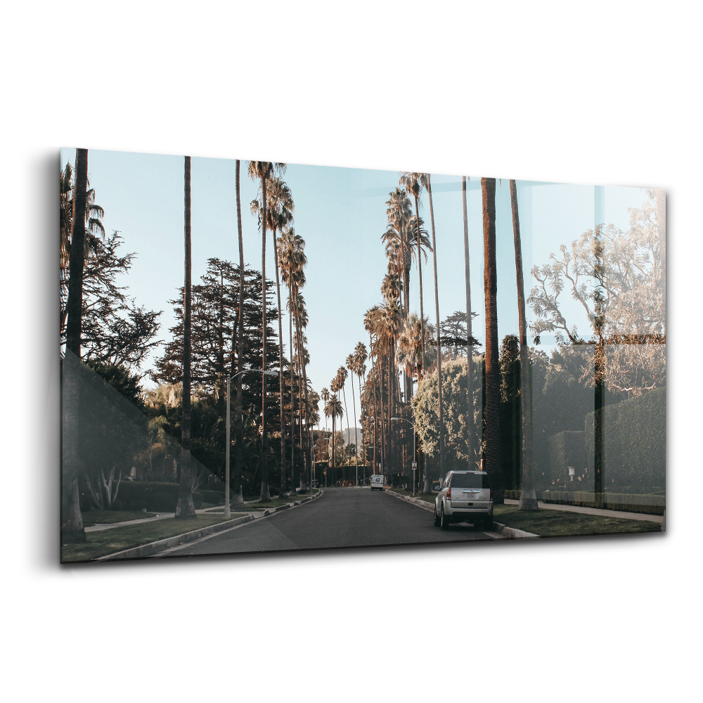 Tablou sticlă Un vehicul pe drum printre copaci