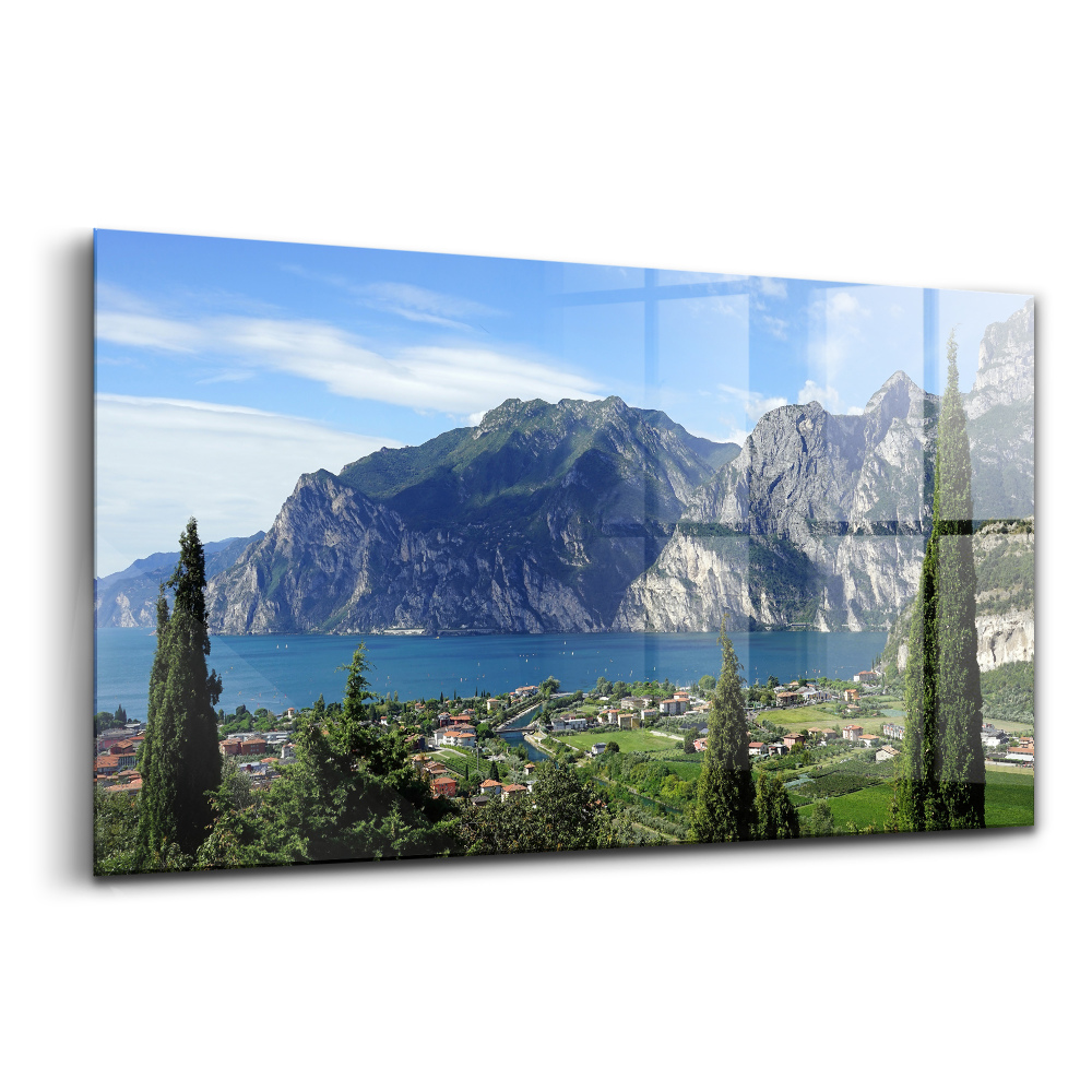 Tablou sticlă Copaci verzi în fața orașului